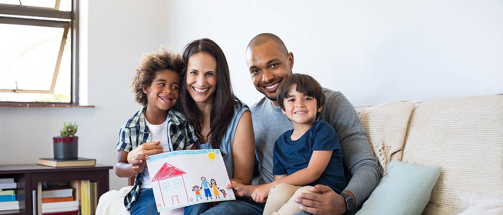 Family sitting together on a couch